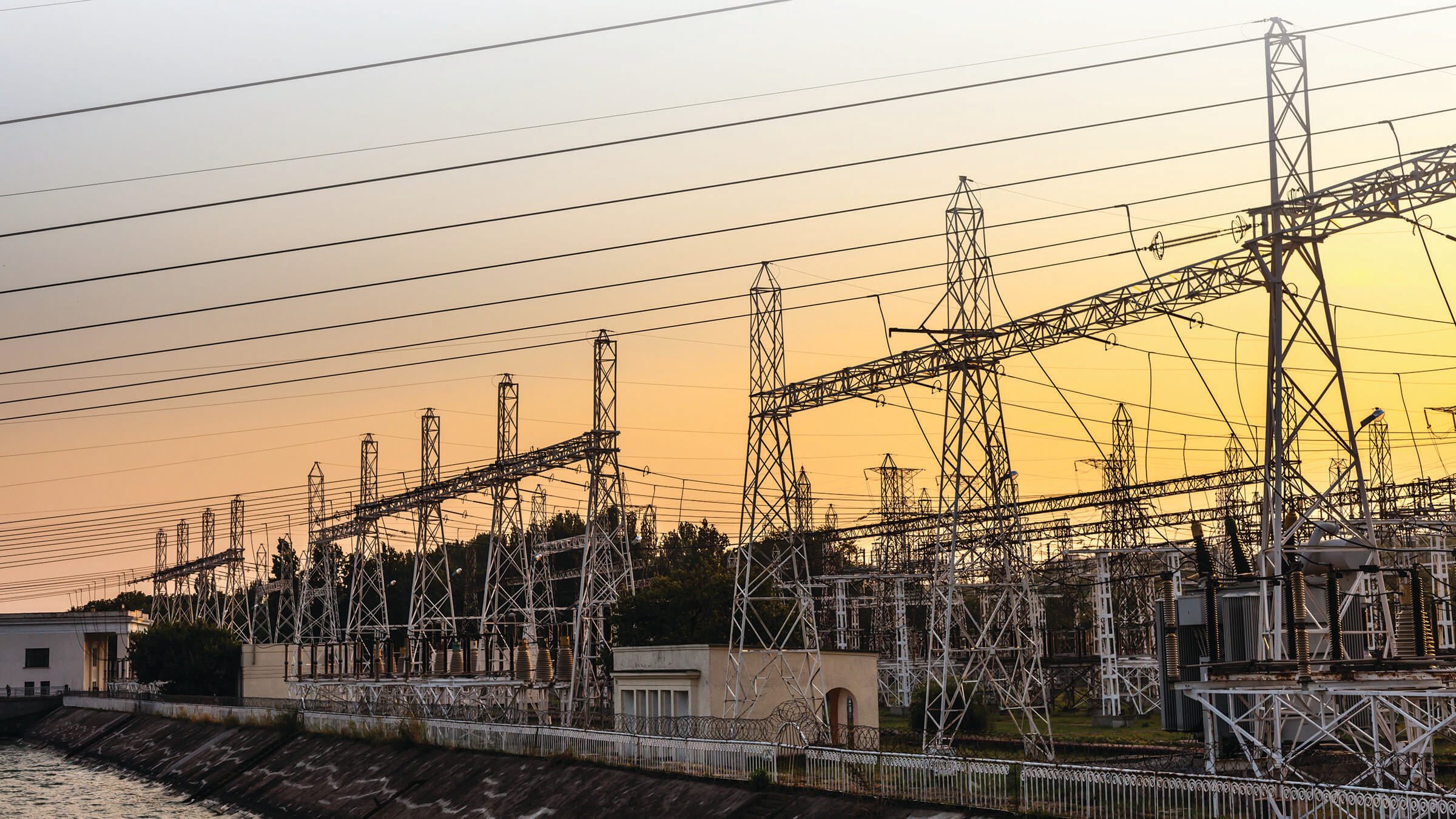 An electrical utility site at dusk reprensenting Senstar's ability to protect critical infrastructure