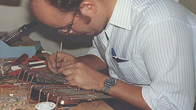 Senstar Corp President Brian Rich working on a product in the company's early years