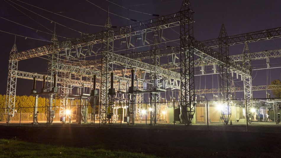 Electrical utility site at night with perimeter fence to demonostrate Senstar's ability to protect electrical utility infrastructure from perimeter intrusions