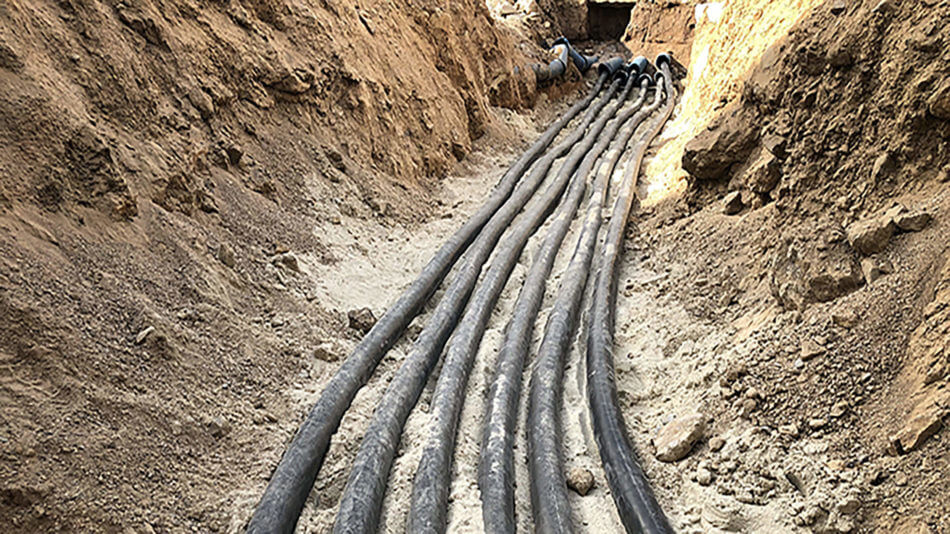 Data conduits in a trench ready to be buried
