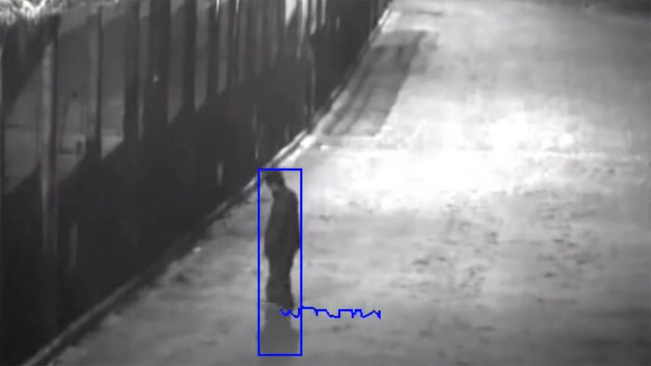 Analytic box around an individual moving towards a fence with a line indicating the path taken so show Senstar's Outdoor Object Tracker video analytic