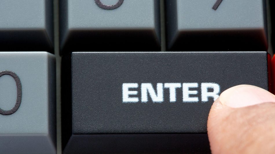 A magnified Enter key on a keyboard to represent Senstar's software downloads