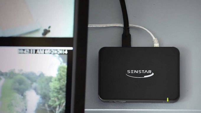 Senstar Thin Client network video display appliance hung on wall behind monitor
